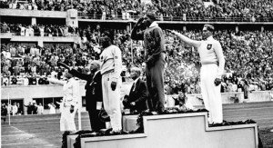 Jesse Owens on the podium at the 1936 Summer Olympics