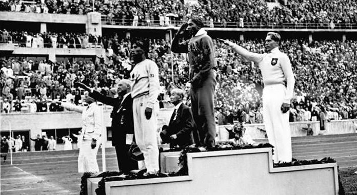 Jesse Owens on the podium at the 1936 Summer Olympics | Learnodo Newtonic