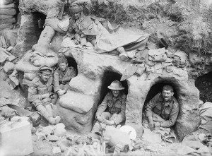Soldiers resting in shallow dugouts during the Somme Offensive