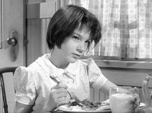 Mary Badham as Scout Finch