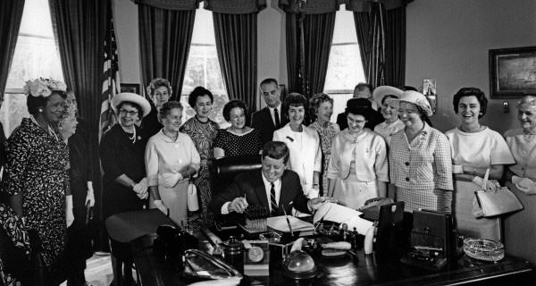 John F. Kennedy signs the Equal Pay Act into law