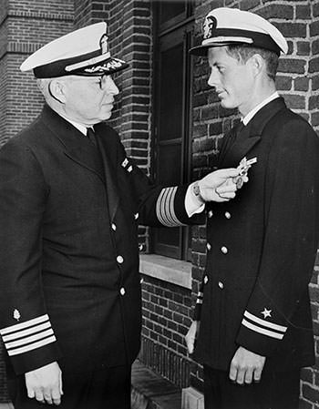 John Kennedy being awarded the Navy and Marine Corps Medal