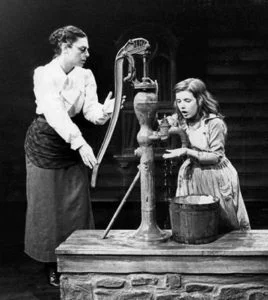 The waterpump scene from the broadway play The Miracle Worker