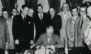 President Truman signing the Housing Act of 1949