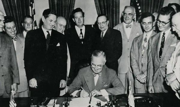 President Truman signing the Housing Act of 1949