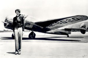 Amelia Earhart in front of Lockheed Electra