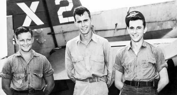 George H.W. Bush (center) as pilot of the United States Navy