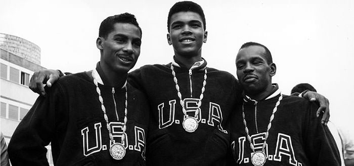 Muhammad Ali (Cassius Clay) wins an Olympic gold and poses among his competitors