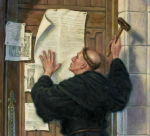 Martin Luther nailing his 95 Theses